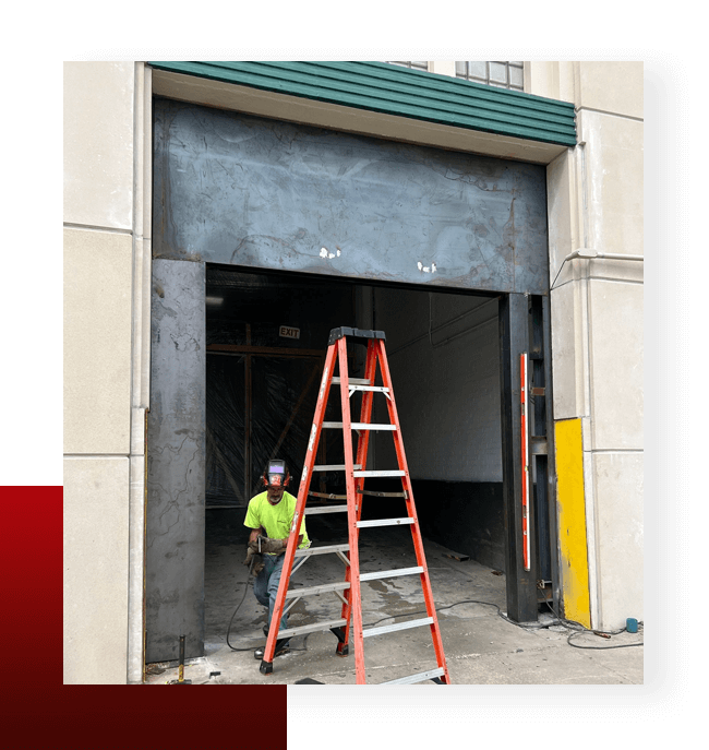 Worker Working in Workshop With Ladder